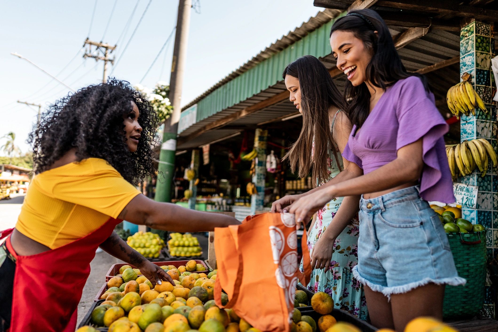 Vendor helping customers at a farmers market