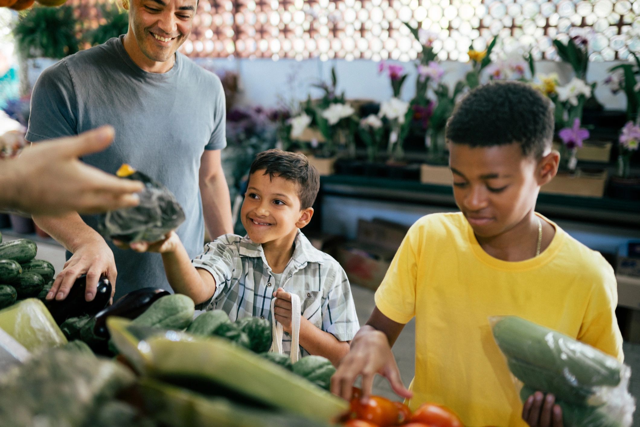 Kids choosing fresh produce at a farmers market